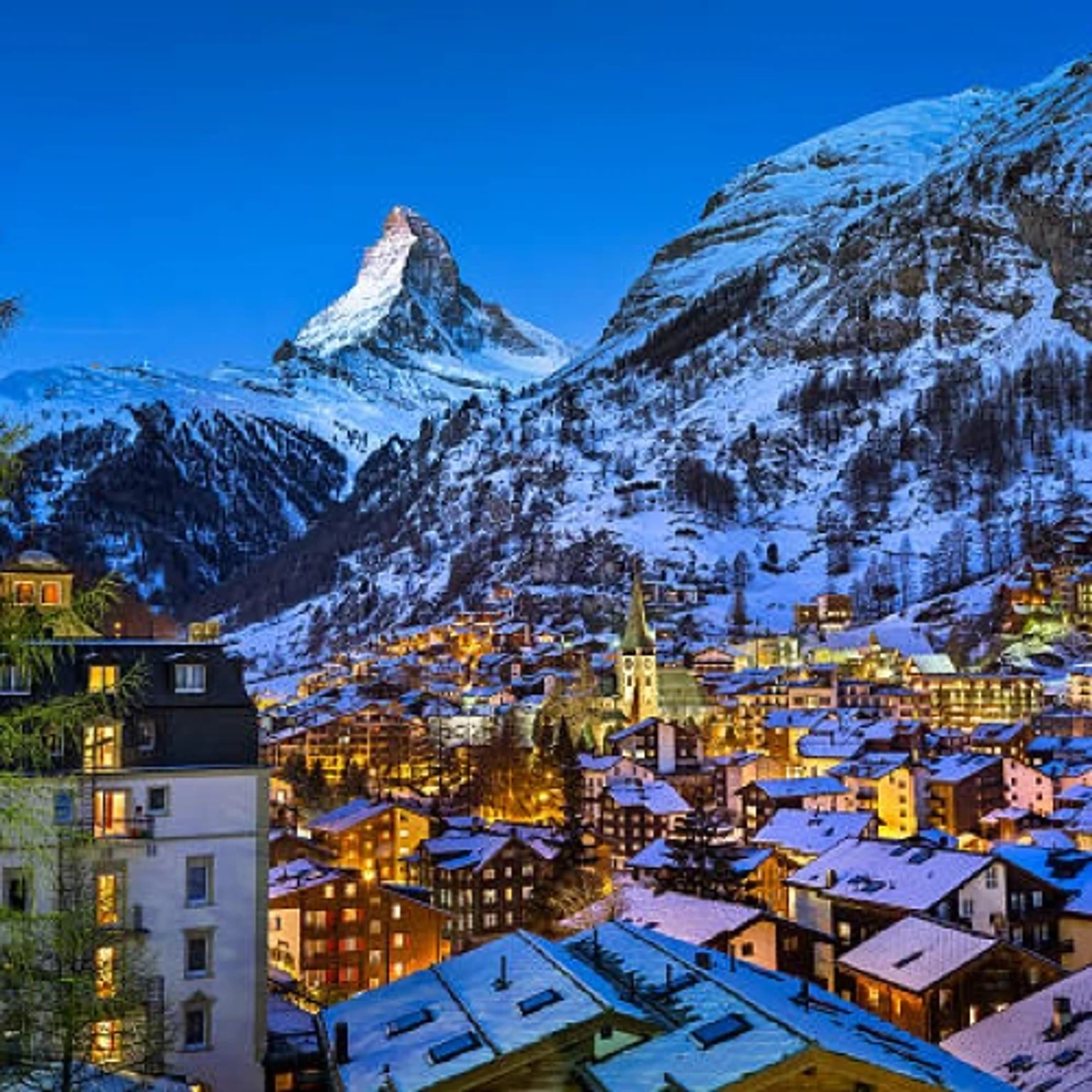 A picturesque holiday package in Switzerland showcasing stunning alpine landscapes and charming villages.