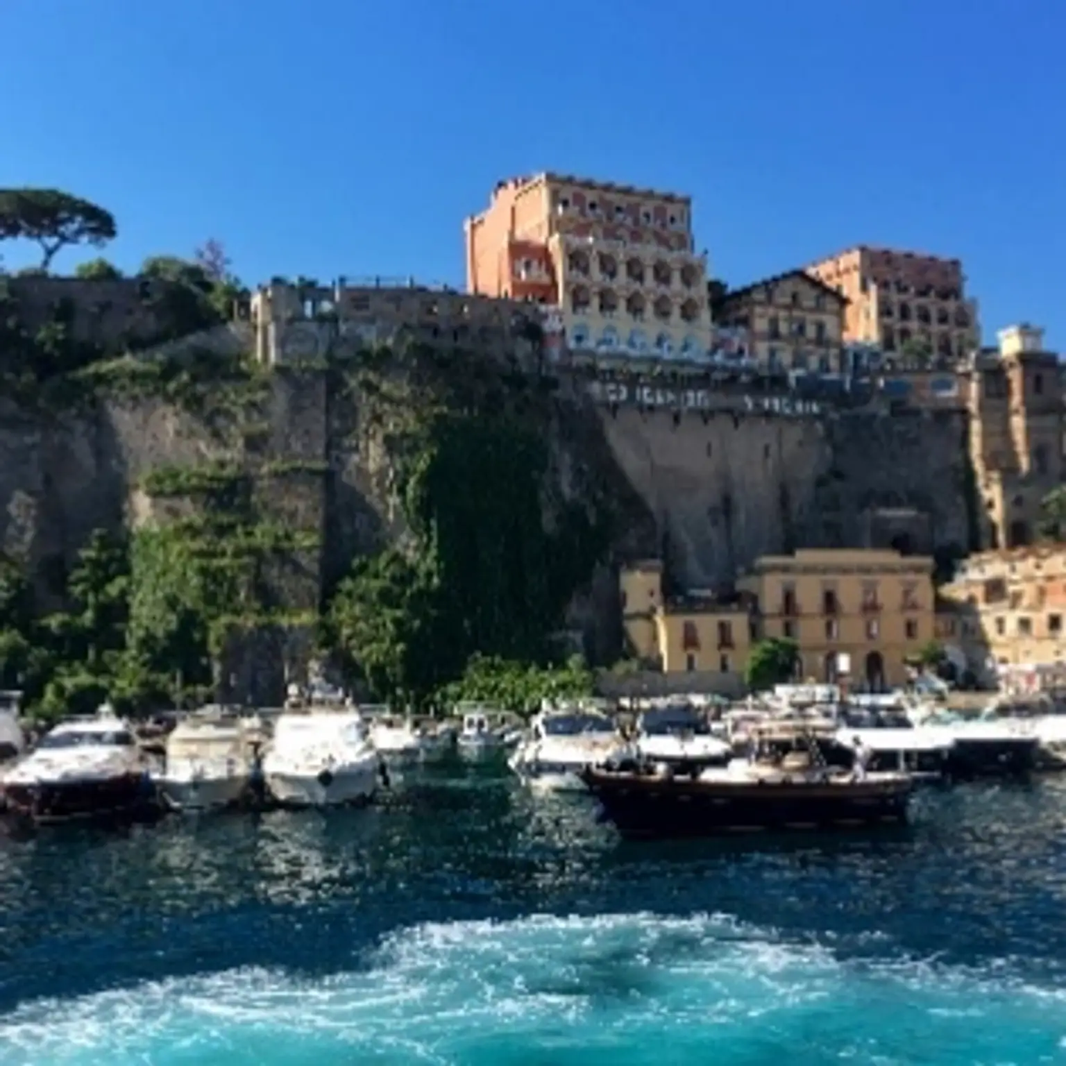 A beautifully arranged holiday package showcasing scenic European landmarks and vibrant travel essentials.