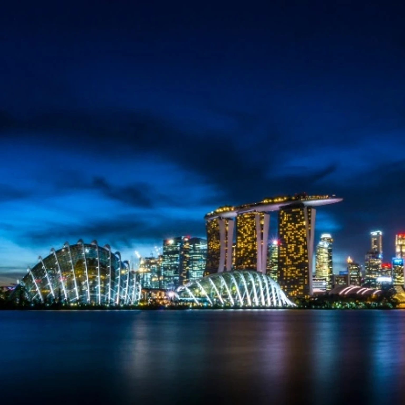 Colorful promotional image showcasing various holiday packages to Singapore, featuring iconic landmarks and attractions.