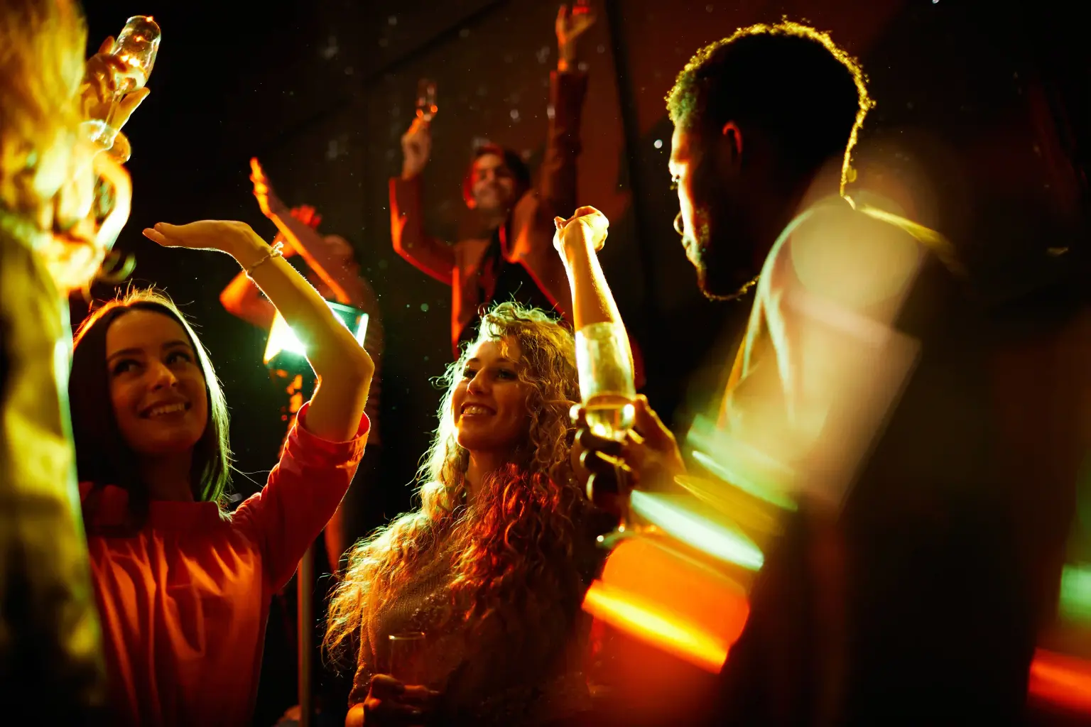 A vibrant city skyline at night, showcasing bustling bars, clubs, and entertainment venues.