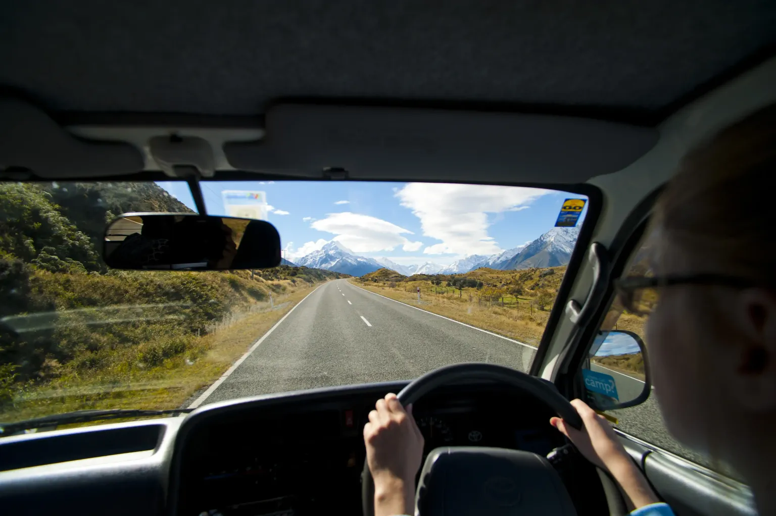 A scenic road winding through picturesque landscapes, perfect for a self-drive adventure.