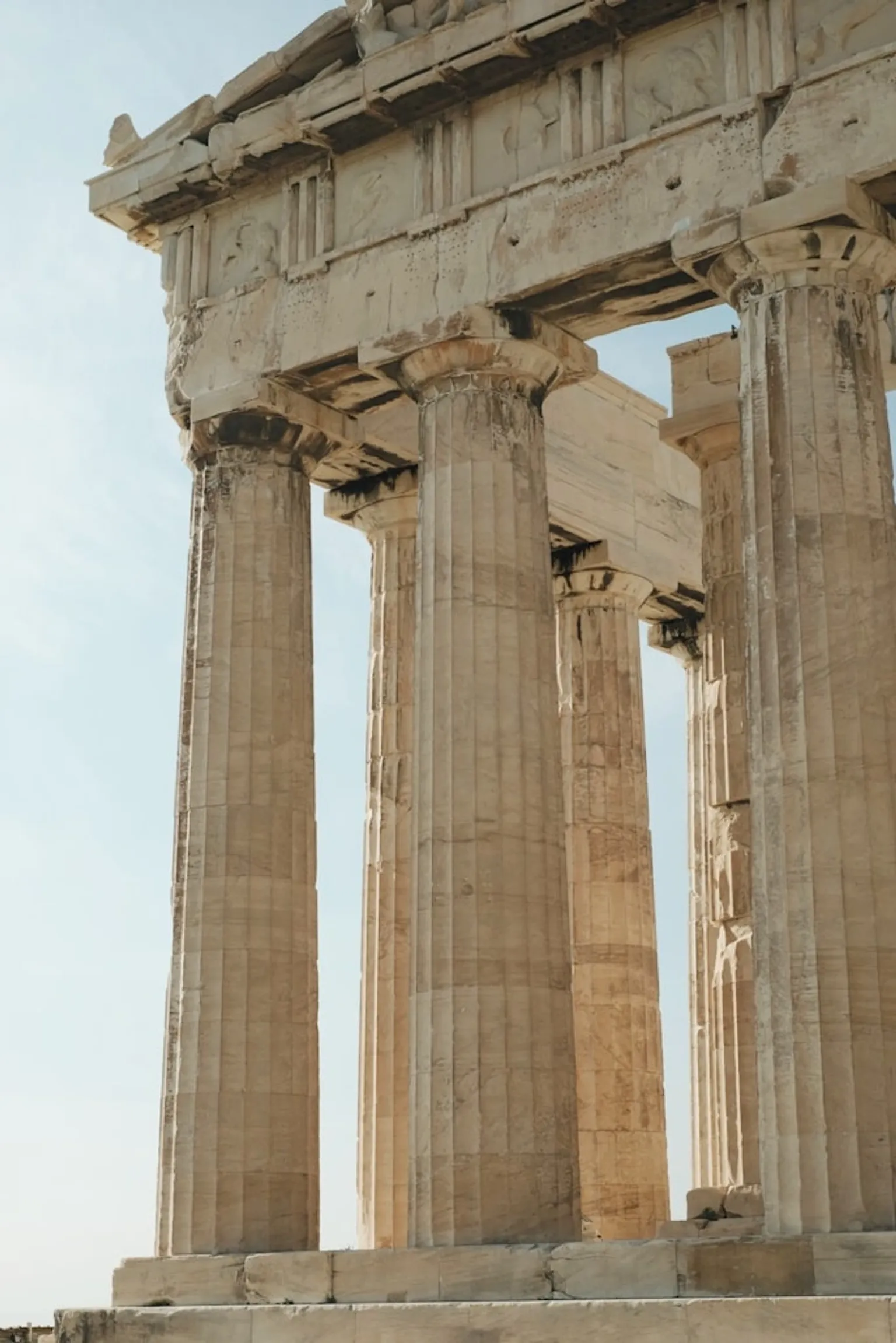 An ancient ruins site showcasing intricate stone carvings and vibrant greenery, inviting exploration and discovery.